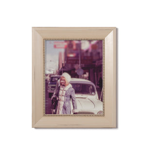 cream frame with gold beads