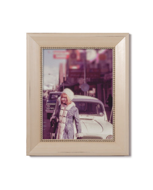 cream frame with gold beads